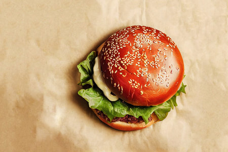 Top view on burger with autumn seasonal vegetable over paper backgroundの素材