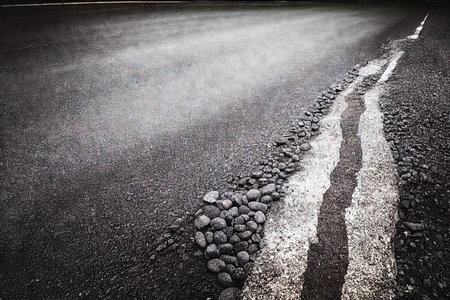 Dirty rough asphalt road surface, textured grunge transport, grey grainy traffic highway transportation way closeup. Abstract background wallpaper of gravel ground roadwayの素材