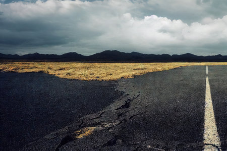 Thunderstorm road highway with dramatic cloudscape horizon abstract background. Extreme weather condition before apocalypse dangerous panoramic viewの素材