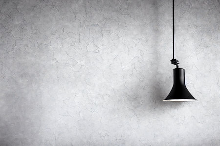 Black lamp on the backgronud of the cracked concrete wall.の素材
