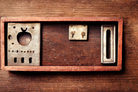 Rectangular keyhole for vintage wrench in wooden frameの素材