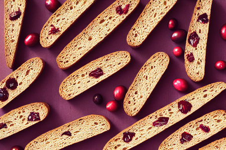 Beautiful smooth slices of cranberry biscotti decorated with nuts and berriesの素材