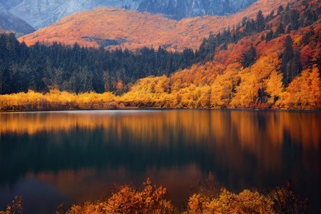 Bright red tones of beautiful natural landscape with mountain lakeの素材