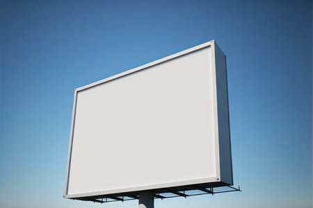 One blank billboard mockup standing on empty field against blue skyの素材