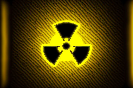 Yellow-lit black sign as radiation hazard symbolの素材