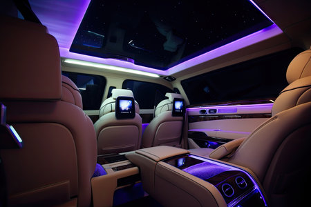luxury car with plush leather seats, touch screen entertainment system, and mood lighting, created with generative aiの素材