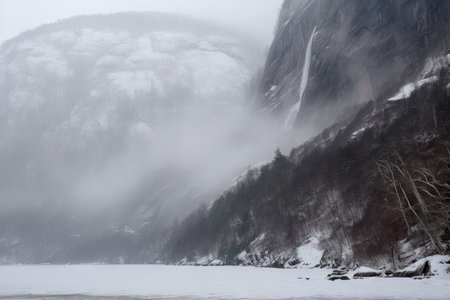 freezing fiord with view of towering waterfall, surrounded by mist, created with generative aiの素材