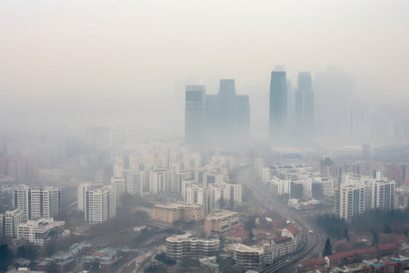 close-up of polluted city skyline, with smog and haze obscuring the view, created with generative aiの素材