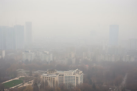 city skyline shrouded in smog, with buildings and landmarks barely visible, created with generative aiの素材