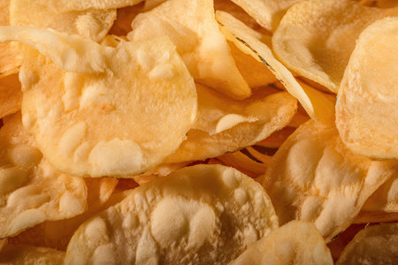 close-up of potato chip, with detailed view of its texture and flavor, created with generative aiの素材