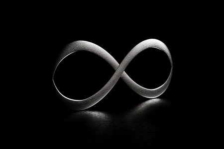 infinity symbol on black background, making a strong and stylish statement, created with generative aiの素材