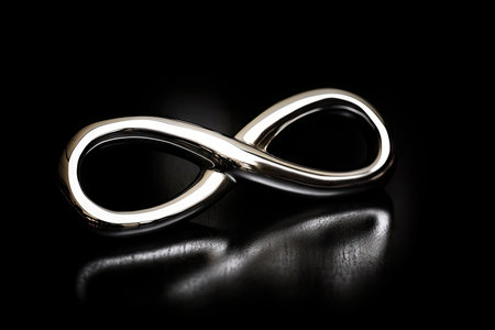 infinity symbol on black background, making a strong and stylish statement, created with generative aiの素材