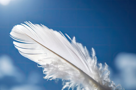white feather blowing in the wind, against blue sky, created with generative aiの素材