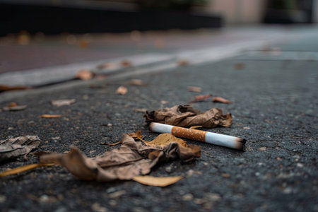 detailed close-up of cigarette on sidewalk, created with generative aiの素材