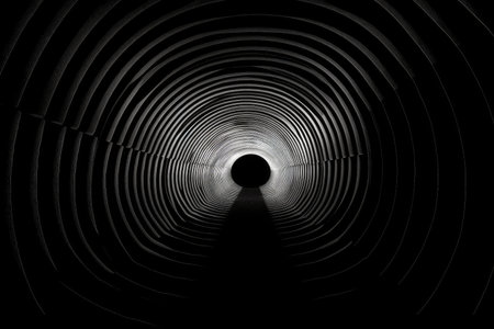 optical illusion of a tunnel with light at the end, leading to another world, created with generative aiの素材