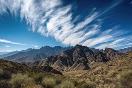majestic mountain range with clear blue skies and fluffy clouds, created with generative aiの素材