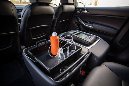 a sleek new car with a variety of accessories, including a phone charger and cup holder, created with generative aiの素材