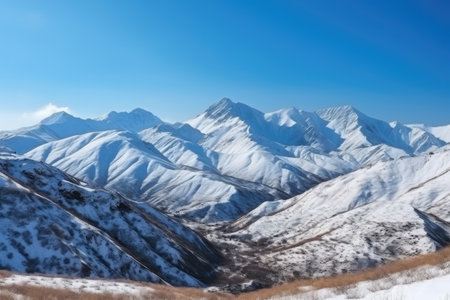 majestic mountain landscape with snow-covered peaks and blue sky, created with generative aiの素材