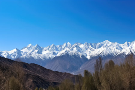 majestic mountain range, with snowcapped peaks and clear blue skies, created with generative aiの素材