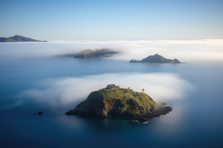 remote island surrounded by cloudlike mist and tranquil waters, created with generative aiの素材