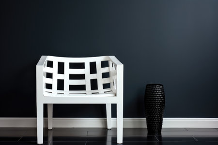 a white modern chair against a monochrome wallの素材