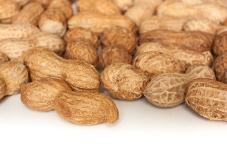 roasted peanuts on a white background
