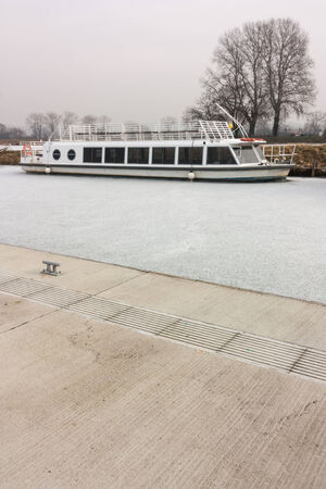 boats on a frozen riverの写真素材