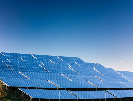 Solar power plant on background with blue sky