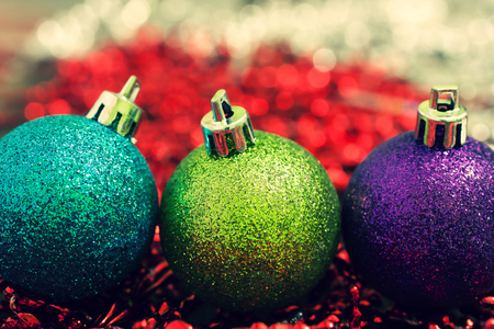 vintage colored Christmas ball on a red backgroundの写真素材