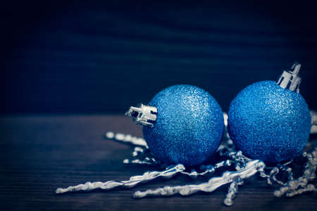 blue Christmas ball on a wooden backgroundの写真素材