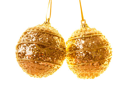 Golden Christmas ball on a white backgroundの写真素材