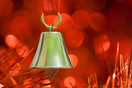 Christmas decoration bell on a red background