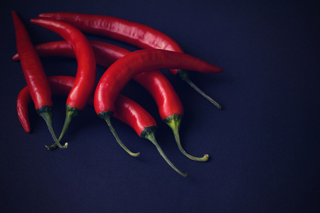 chilli peppers on black backgroundの写真素材