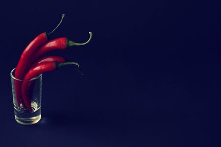 chilli peppers on black backgroundの写真素材