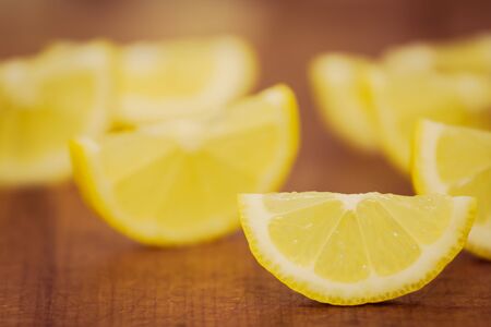lemon slices on a wooden backgroundの写真素材