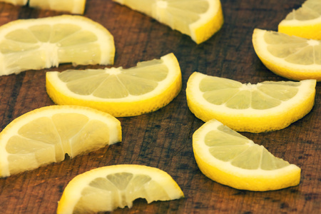 lemon slices on a wooden backgroundの写真素材