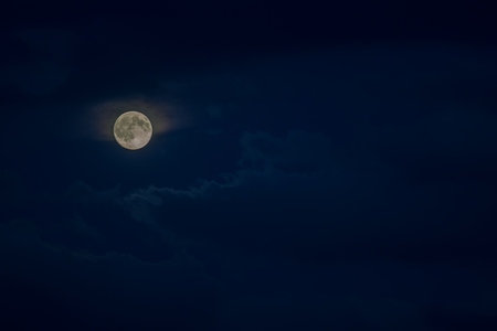 moon in the night sky cloudyの写真素材