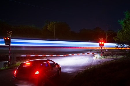 closed railway barrier when a train passesの写真素材