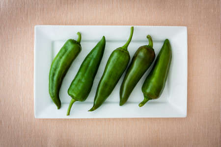 green peppers on a white plateの写真素材