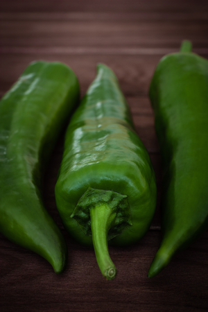 green peppers on wooden backgroundの写真素材