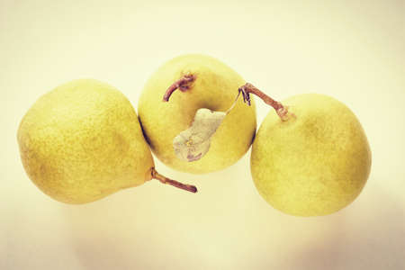 yellow pear on a light backgroundの写真素材