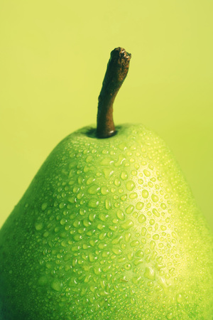 Close up of grean pear with drops of waterの写真素材
