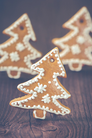 Christmas gingerbread decoration on the wooden backgroundの写真素材