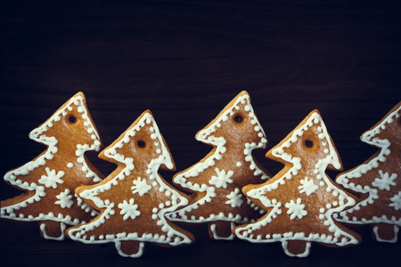 Christmas gingerbread decoration on the wooden backgroundの写真素材