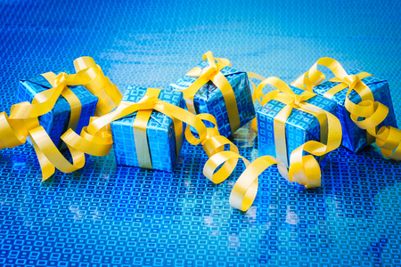 blue gift with yellow ribbonの写真素材