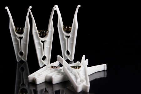 composition with five clothespins on a black backgroundの写真素材