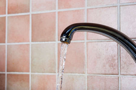 tap open, waste of waterの写真素材