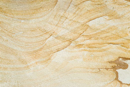 mottled stone texture pattern with veins in warm tonesの写真素材