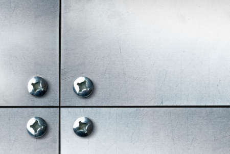 metallic plate with screws