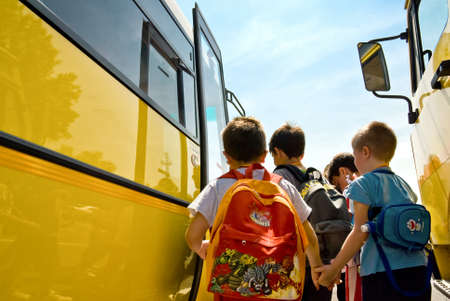 children of primary school catching the schoolbus